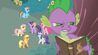 Applejack, looking up at Spike.