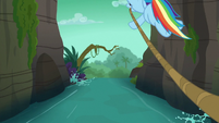 Ravine rapids ending in a waterfall S6E13