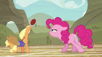 Applejack bucking the ball with one hoof S6E18