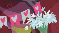 Floral and banner decorations in the barn S8E10
