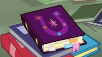 Friendship journal on the library floor S4E25