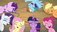 Ponies laughing together on the ground S8E13