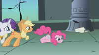 Pinkie Pie loses her balance from leaning over too much.