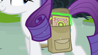 Rarity keeping the book in her saddlebag S4E23