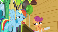 Scootaloo rolling up her Washouts poster S8E20