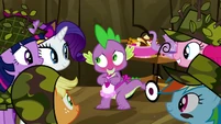 Everypony smiles, while Spike blushes.