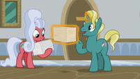 Students with stacks of worksheets S8E16