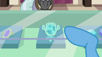 Trixie pointing at brooch in display case S7E2
