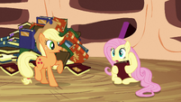 Fluttershy holds a book with her hooves S3E05