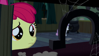 Apple Bloom looking at an upright horseshoe S5E6