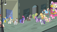 Main cast walking beside a line of ponies S4E08