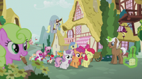 Crusaders lead a parade through Ponyville S5E18