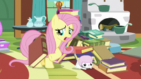 Fluttershy unburies Angel from book pile S7E5