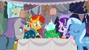 Starlight and friends gathered around the cake S9E11