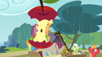 Two umbrellas taking the form of an apple core S4E09