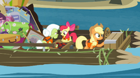 Apple Bloom and Granny Smith playing a game while Applejack controls the raft S4E09