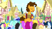Cheese playing accordion while ponies surround him S4E12