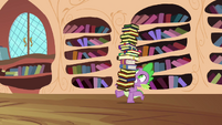 Spike carrying a tower of books S03E10