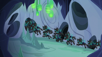 Changeling swarm flying down center tunnel S6E26