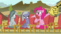 Pinkie wearing the same foam finger.