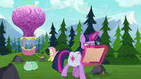 Twilight looks at map while Fluttershy ties up balloon S5E23