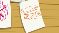 A sheet of paper showing bees and a beekeeper hat S6E4