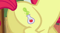 Close-up of Apple Bloom's potion-making cutie mark S5E4