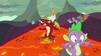 Spike and Garble surf down the lava slope S7E25