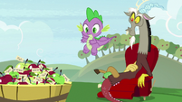 Basket of apples in front of Spike and Discord S9E23