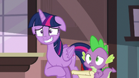 Twilight Sparkle grinning nervously at her friends S6E22