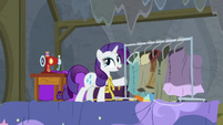Rarity next to a rack of costumes S8E7