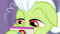 Close-up on Granny reading a card S9E16