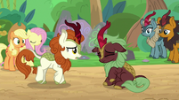 Dark-red Kirin shaking her head S8E23