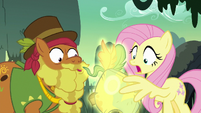 Meadowbrook's mask glows in Fluttershy's wing S7E25