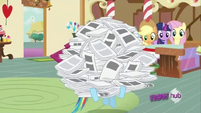 Rainbow Dash and a pile of newspapers