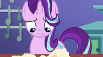 Starlight looks at her ruined teacakes S7E2