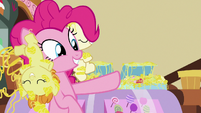 Pinkie Pie pointing at cupcakes behind her S7E19