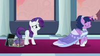 Twilight walks toward balcony as Rarity cries S9E26