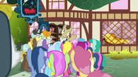 Davenport addresses a crowd outside his store S7E19