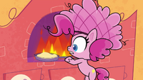 Pinkie removing pan from the stove PLS1E1b