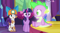 Rarity smiles nervously at Spike S6E5