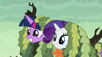 Twilight and Rarity poke their heads out of the seaweed S6E5