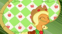 Applejack, with a rope with her mouth.