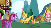 Berryshine along with other ponies walking around Ponyville S1E01
