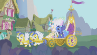 Celestia and Luna ride a chariot into Ponyville S1E02