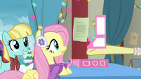 Flim giving a Holly the Hearth Warmer doll to Fluttershy MLPBGE