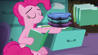 Pinkie holding edible rock candy plates S8E3