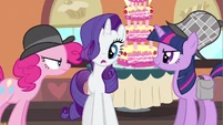 I don't think Twilight is admiring Rarity's new hair do.
