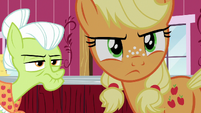 Applejack looking back toward the farm gate S6E23