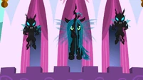 Chrysalis in flight with two changelings